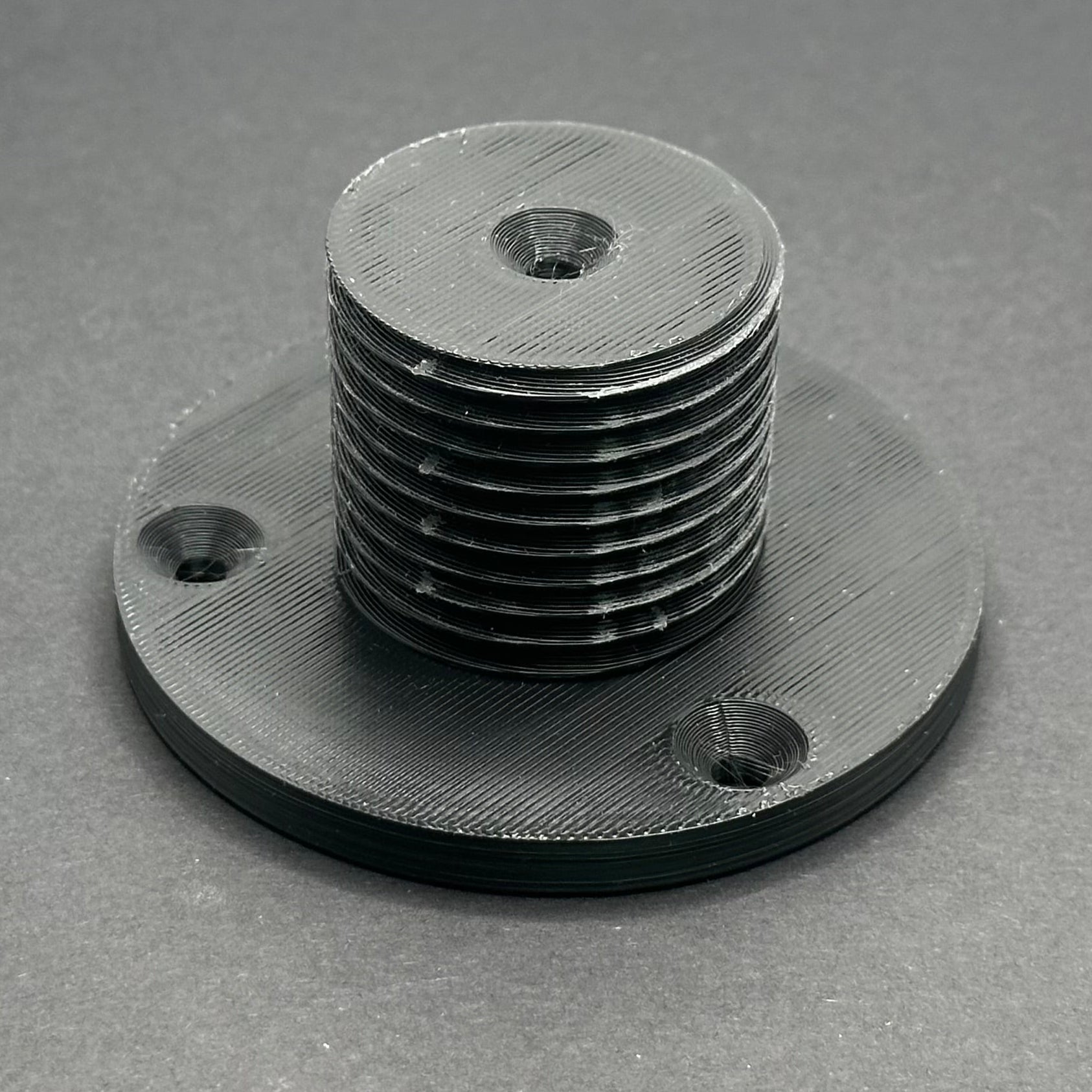 3D printed lathe chuck holder mounted on workshop wall