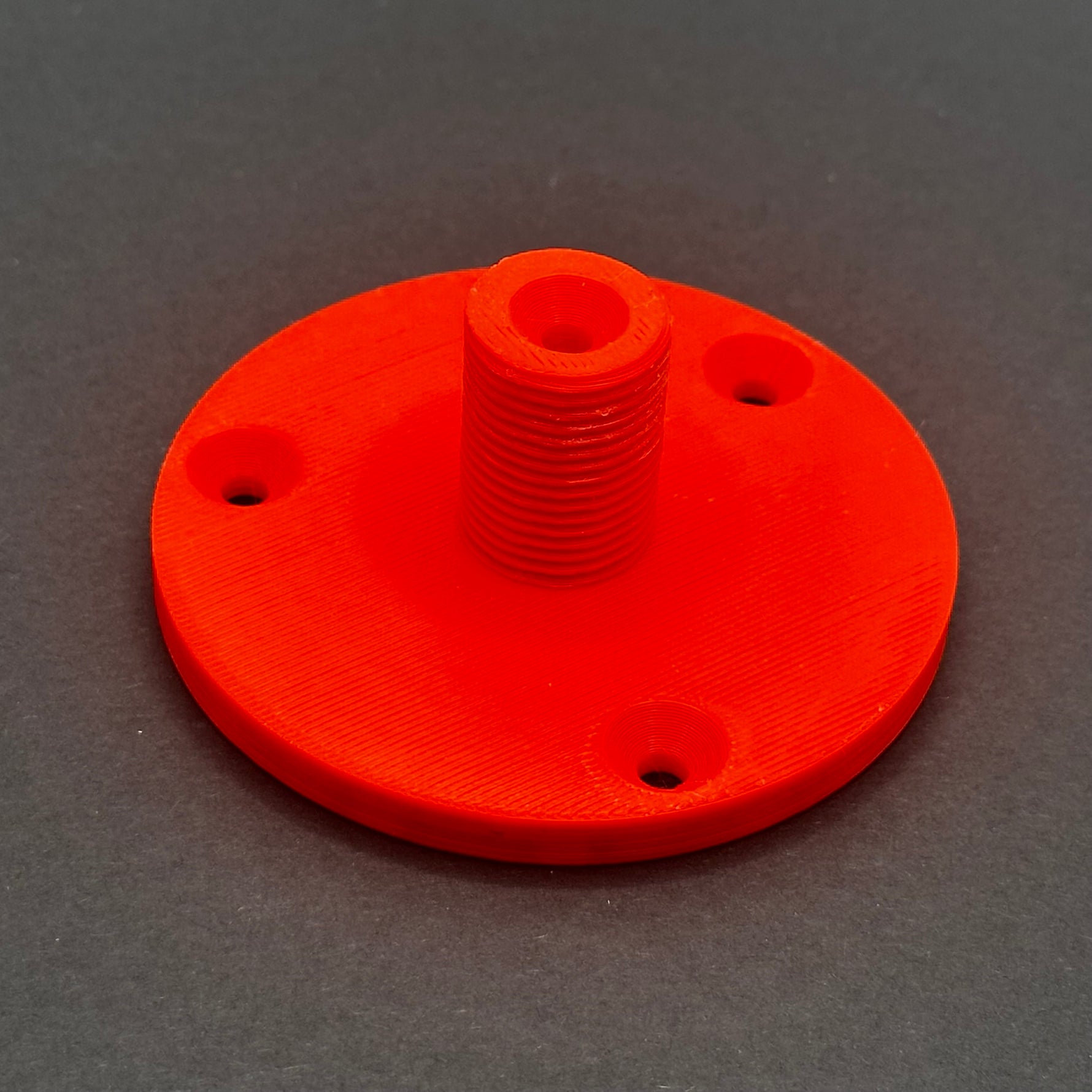 3D printed lathe chuck holder mounted on workshop wall