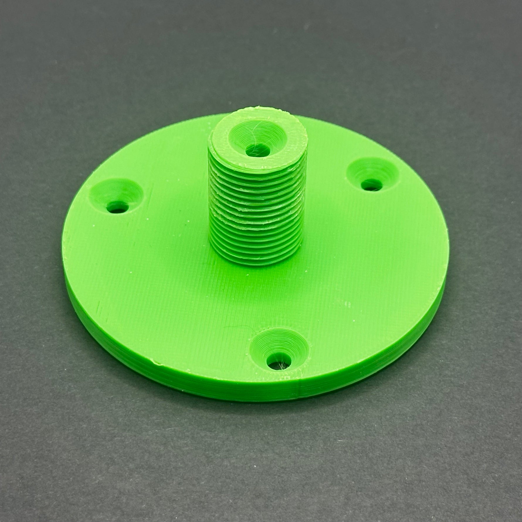 3D printed lathe chuck holder mounted on workshop wall