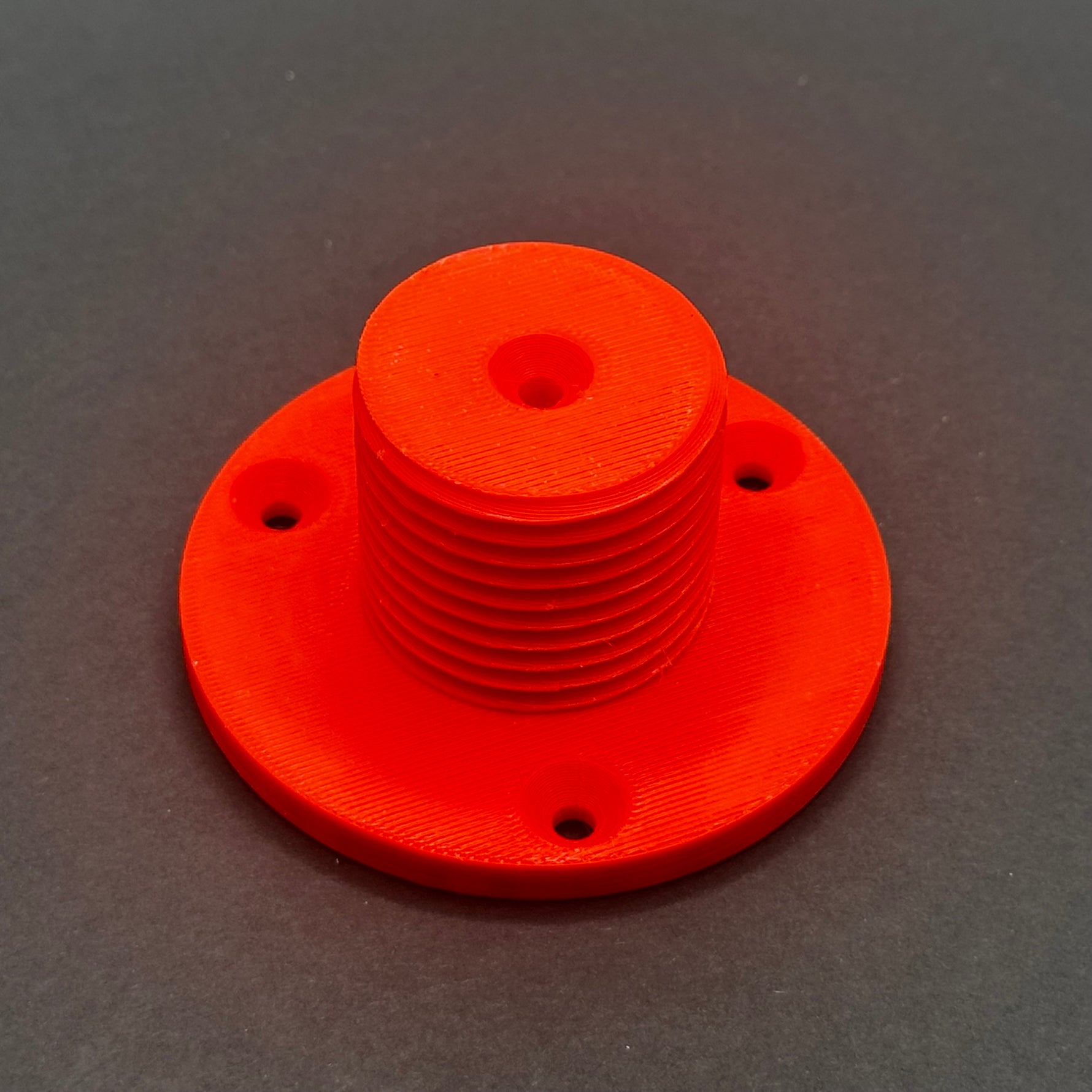 3D printed lathe chuck holder mounted on workshop wall