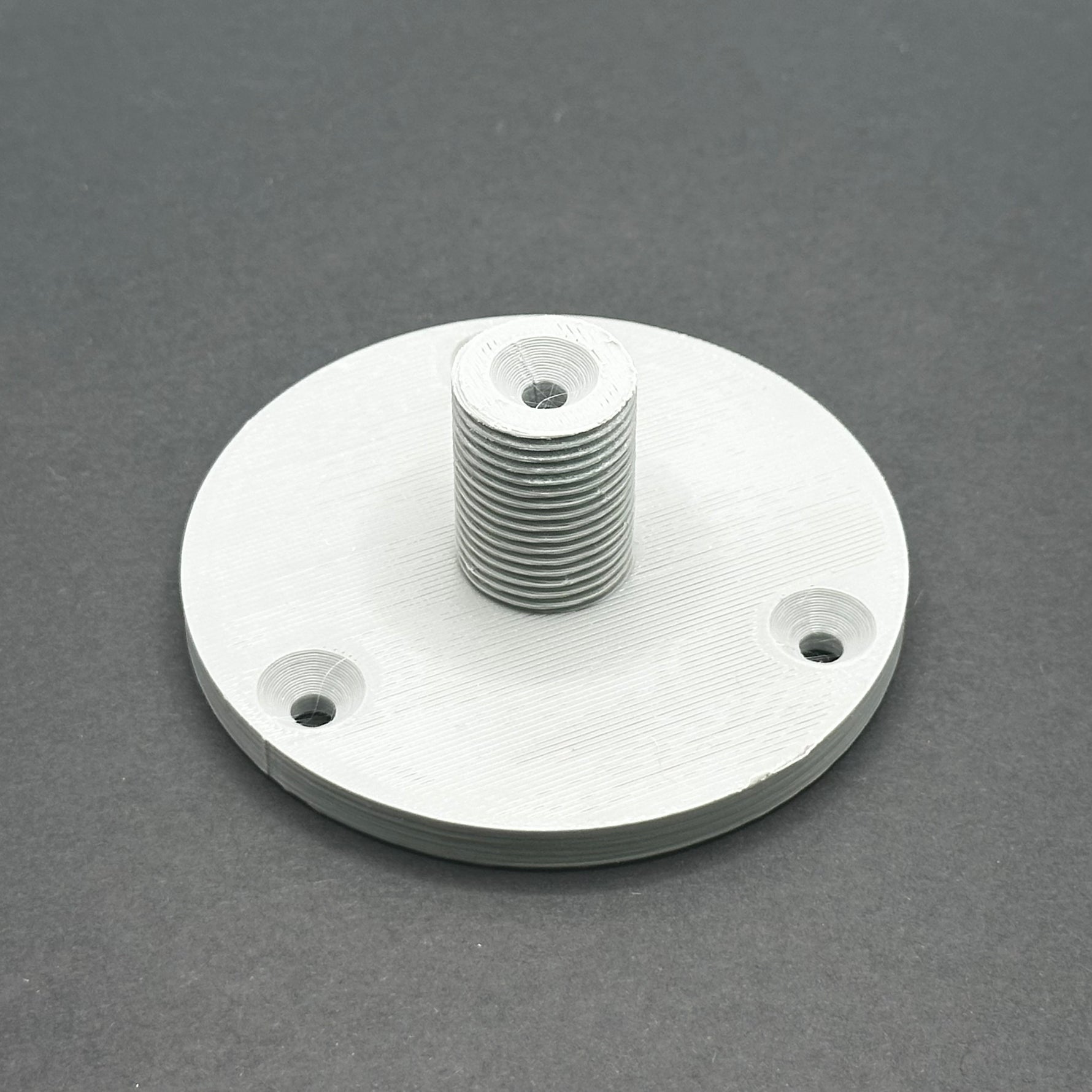 3D printed lathe chuck holder mounted on workshop wall