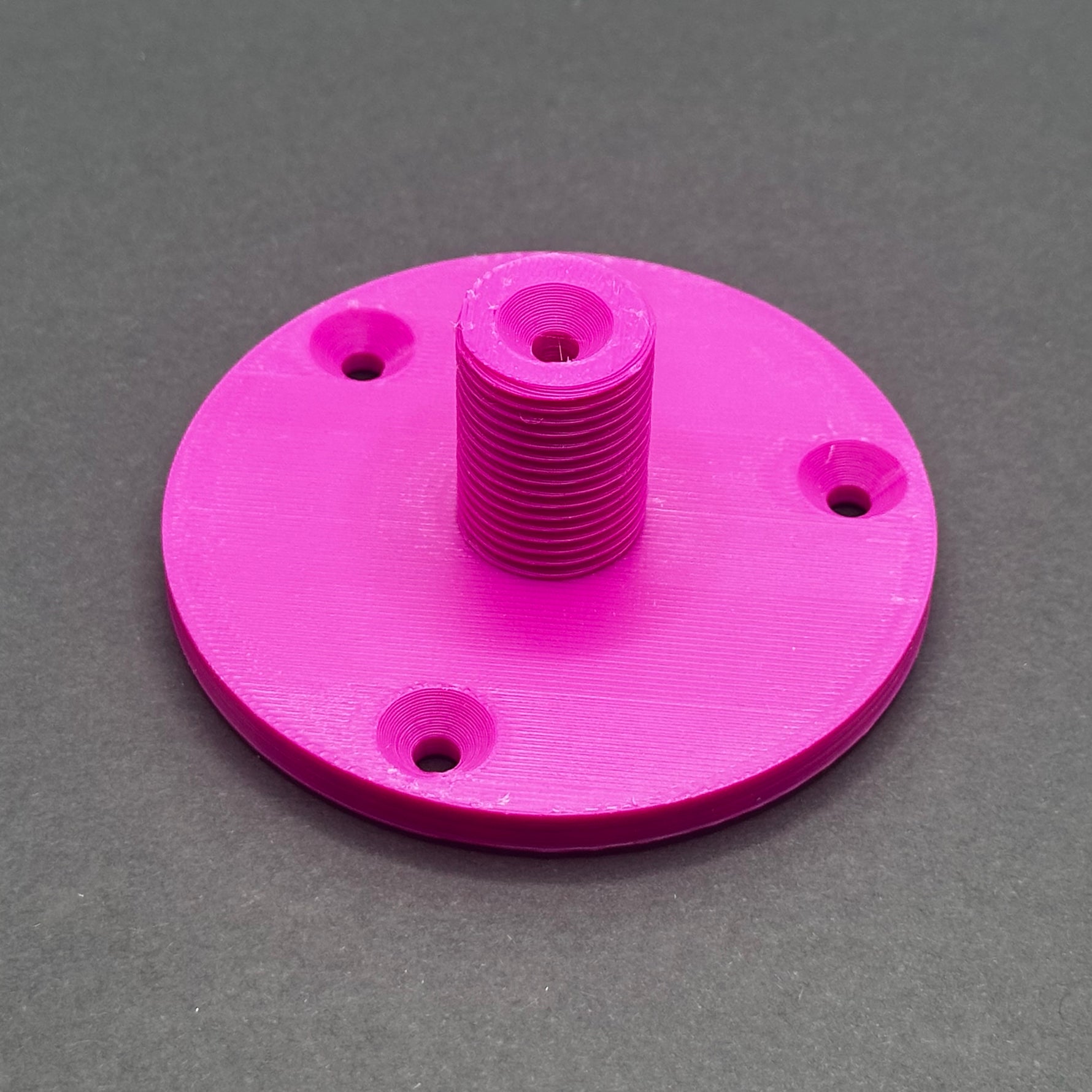 3D printed lathe chuck holder mounted on workshop wall