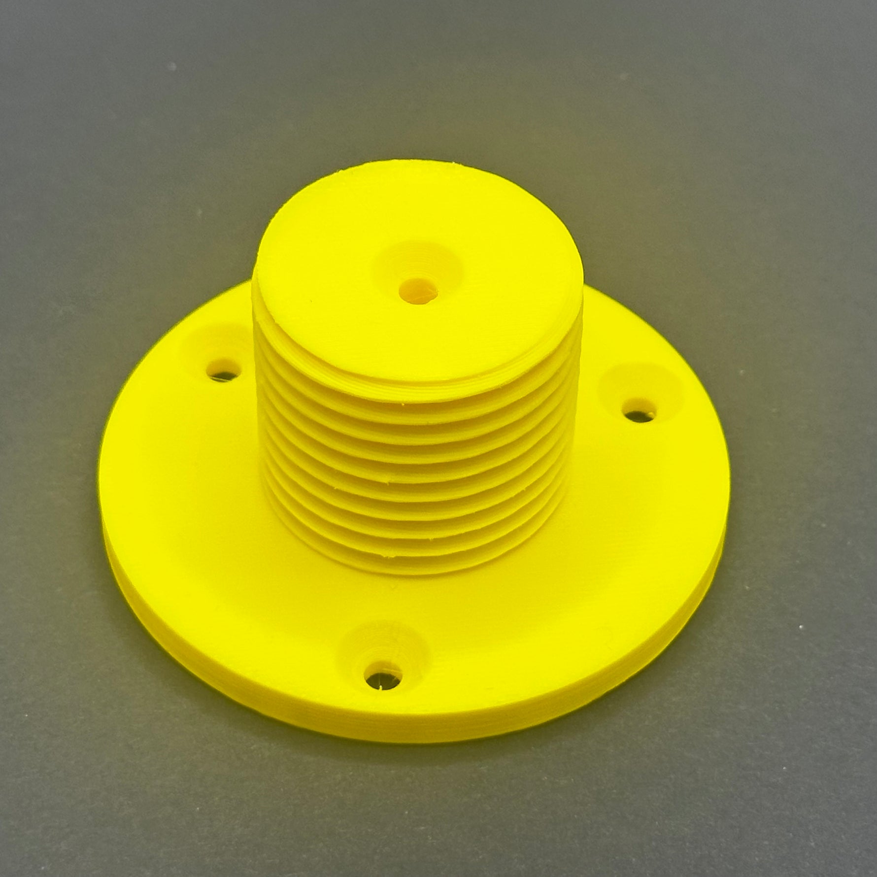 3D printed lathe chuck holder mounted on workshop wall