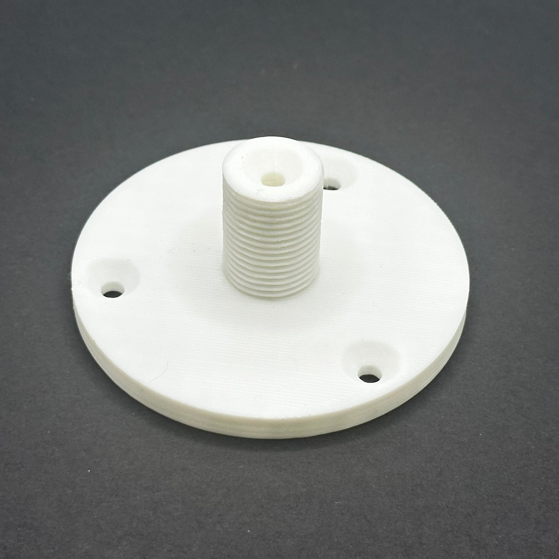 3D printed lathe chuck holder mounted on workshop wall