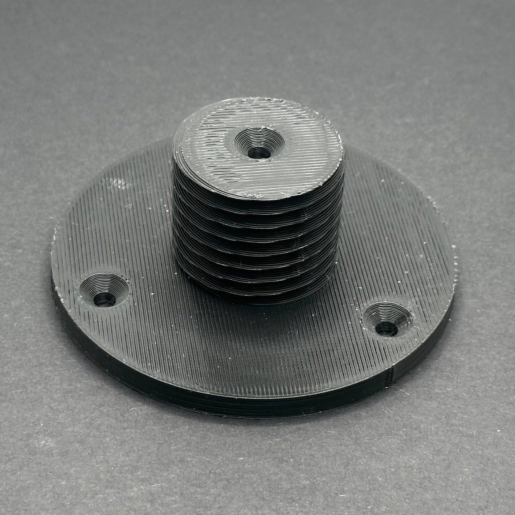 3D printed lathe chuck holder mounted on workshop wall