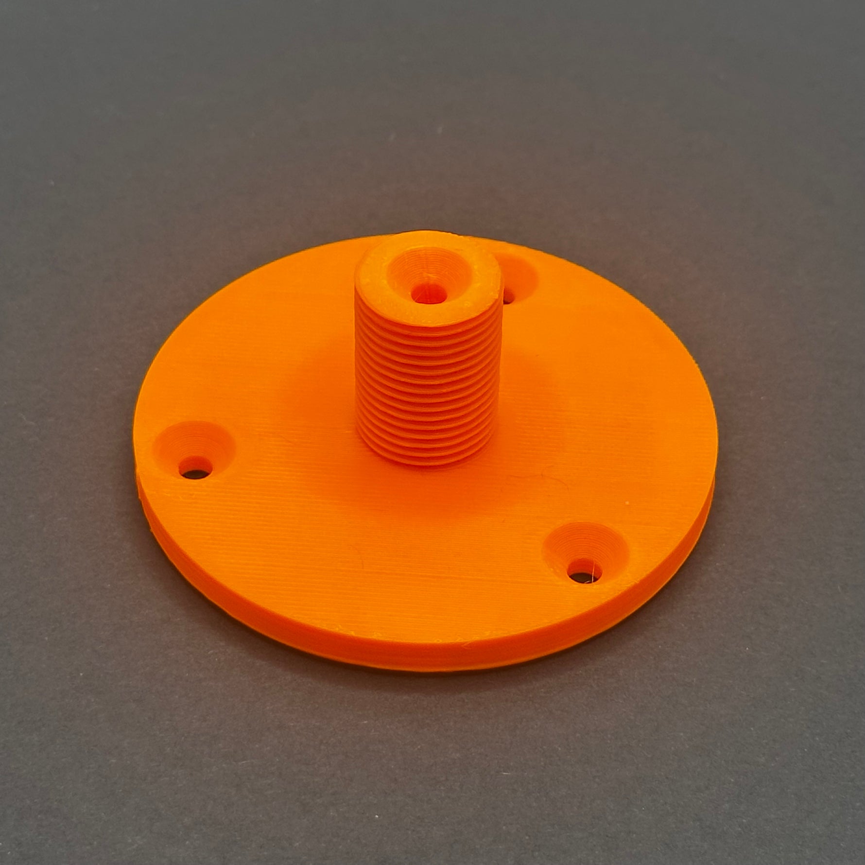 3D printed lathe chuck holder mounted on workshop wall