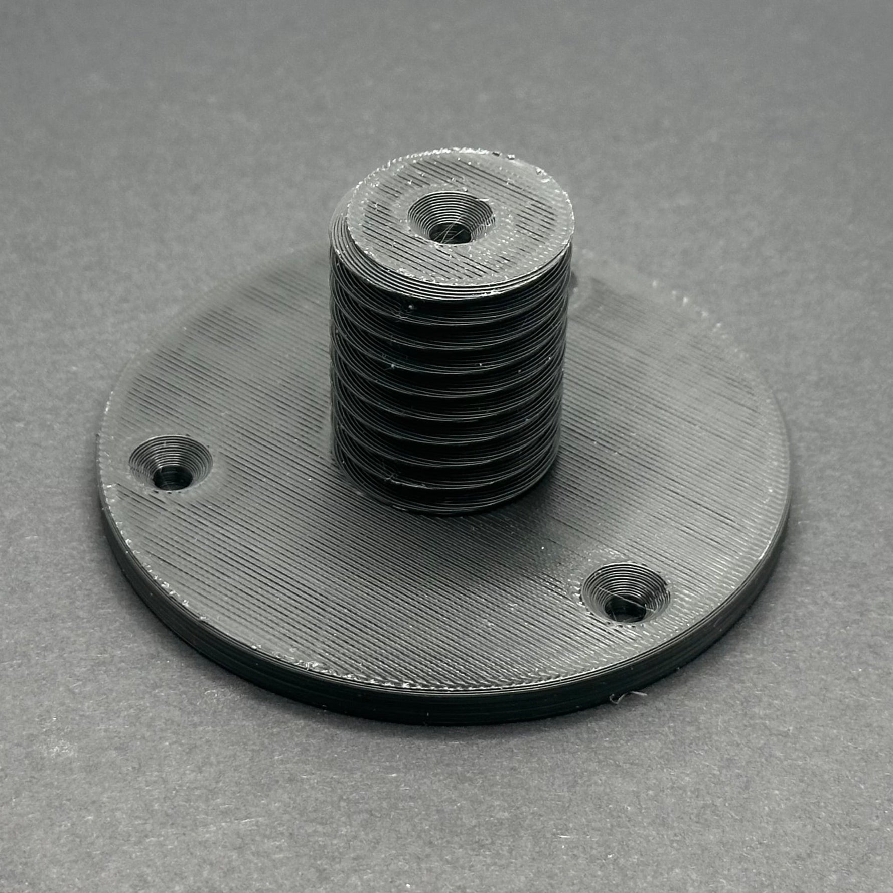 3D printed lathe chuck holder mounted on workshop wall