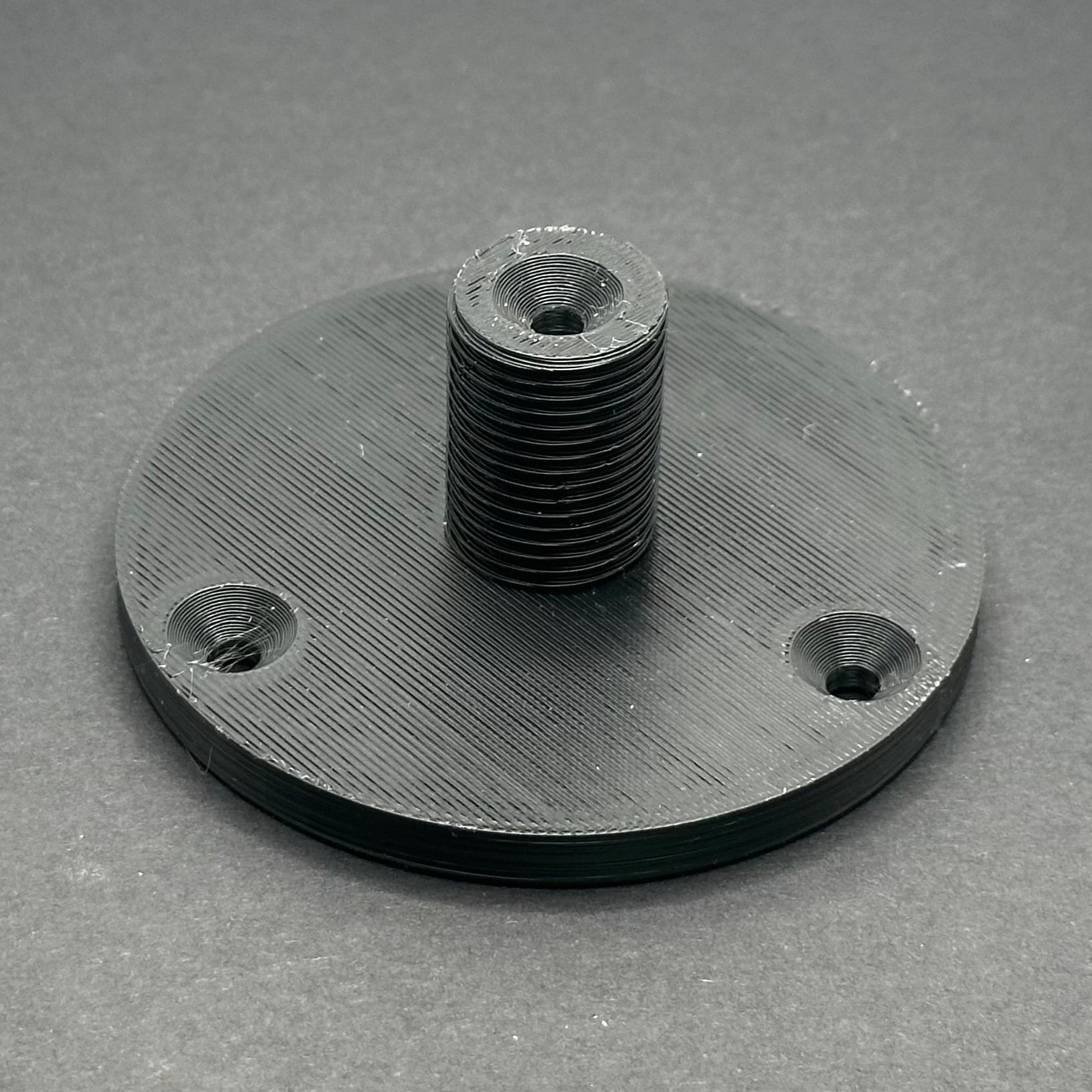 3D printed lathe chuck holder mounted on workshop wall