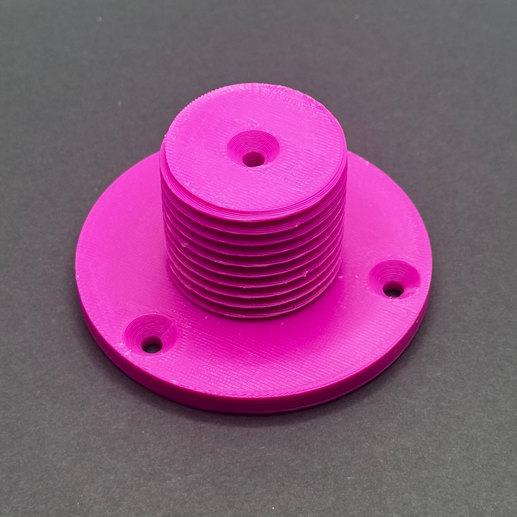 3D printed lathe chuck holder mounted on workshop wall