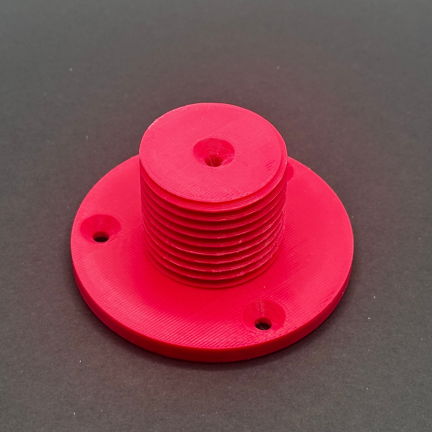 3D printed lathe chuck holder mounted on workshop wall