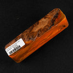 Hybrid burl call blank BC-0008 showcasing rich brown wood grain encased in vibrant translucent orange resin