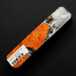 Hybrid burl call blank BC-0012 showcasing vibrant orange wood grain next to metallic silver and black resin areas