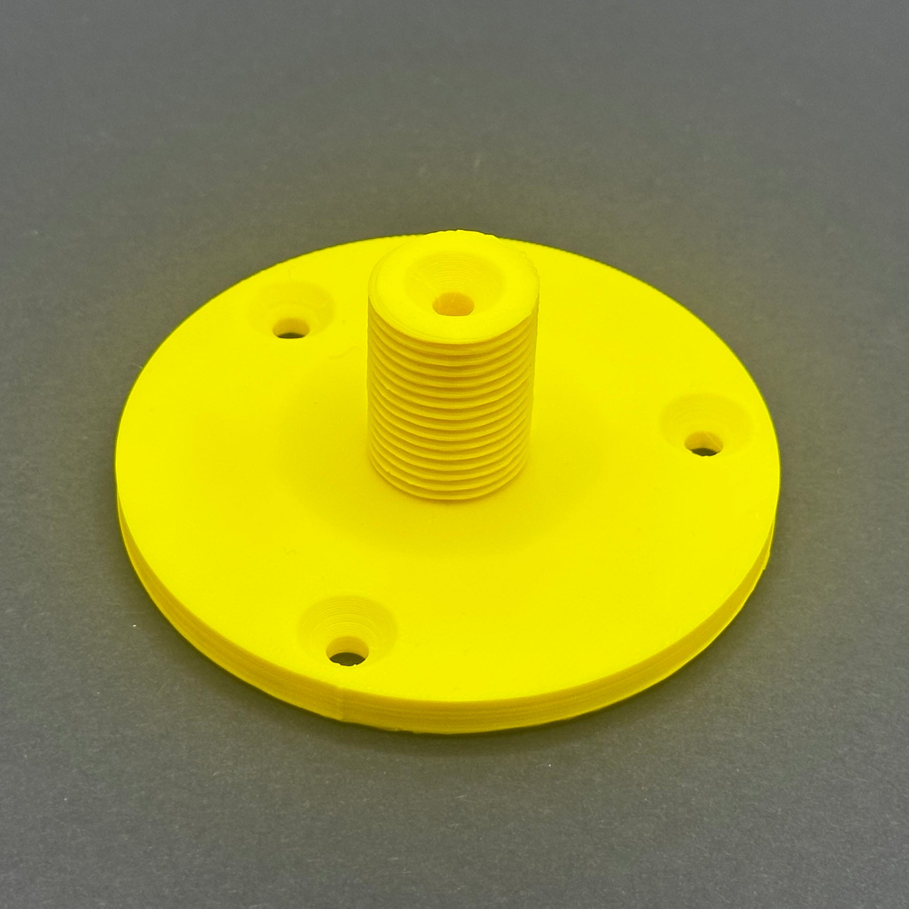 3D printed lathe chuck holder mounted on workshop wall