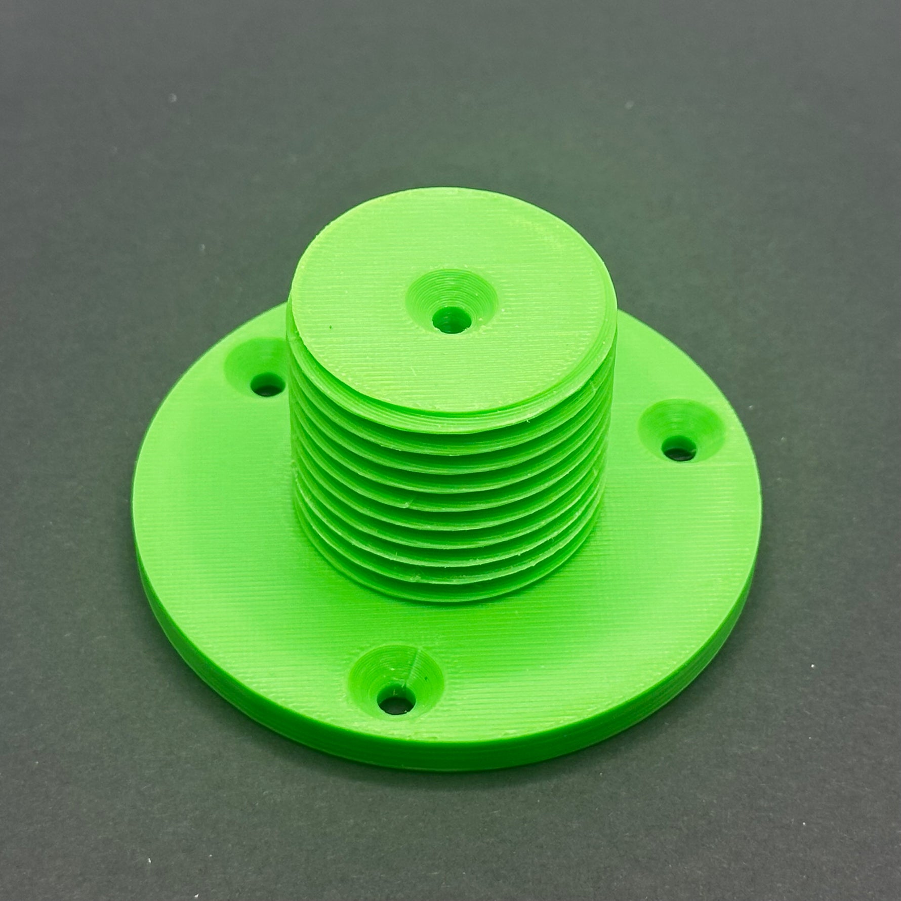 3D printed lathe chuck holder mounted on workshop wall