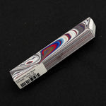 Solid Fordite pen blank FR-0002 displaying vibrant red, blue and white layered paint swirls from decades of factory overspray