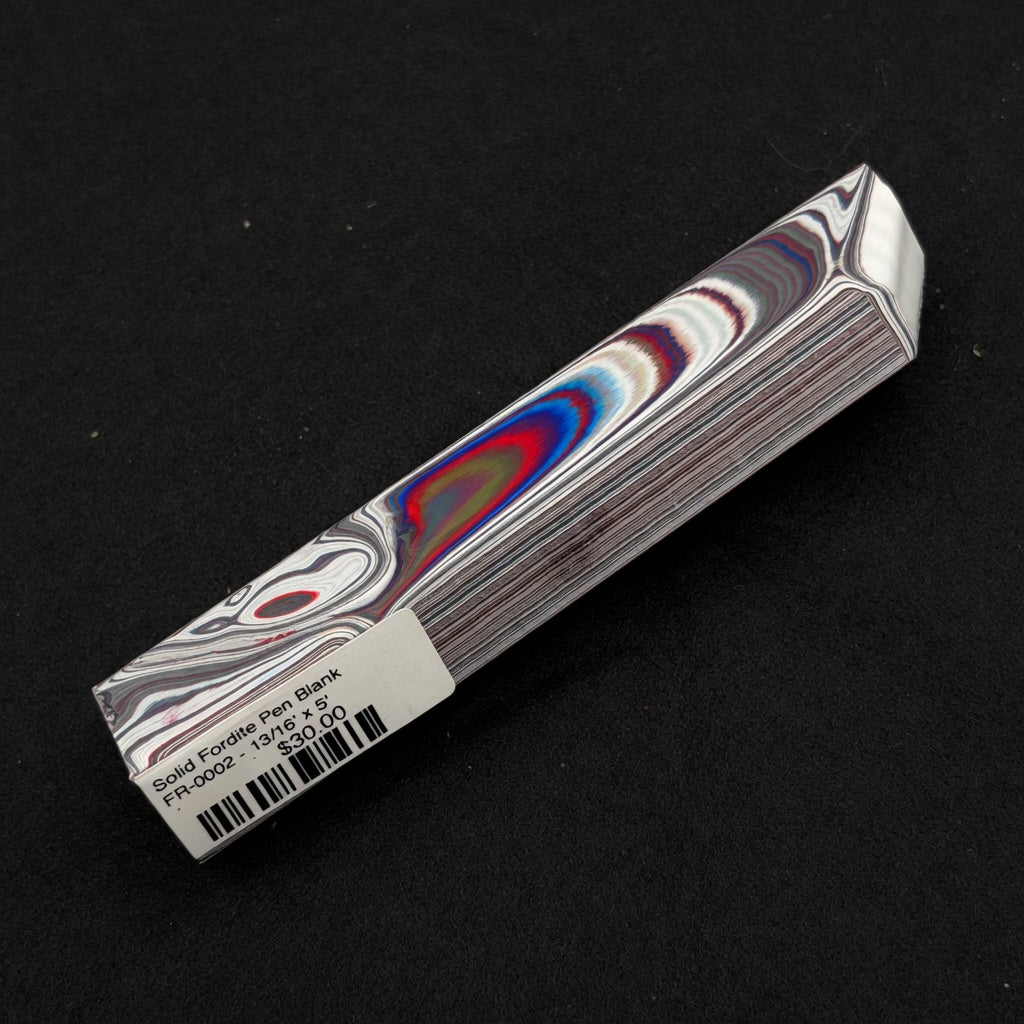 Solid Fordite pen blank FR-0002 displaying vibrant red, blue and white layered paint swirls from decades of factory overspray