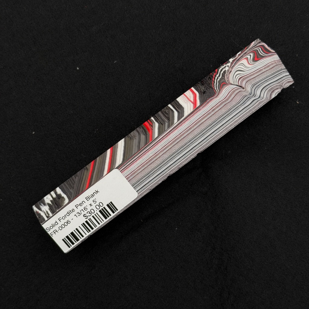 Solid Fordite pen blank FR-0006 displaying bold red, black, white and gray layered stripes with fluid swirls
