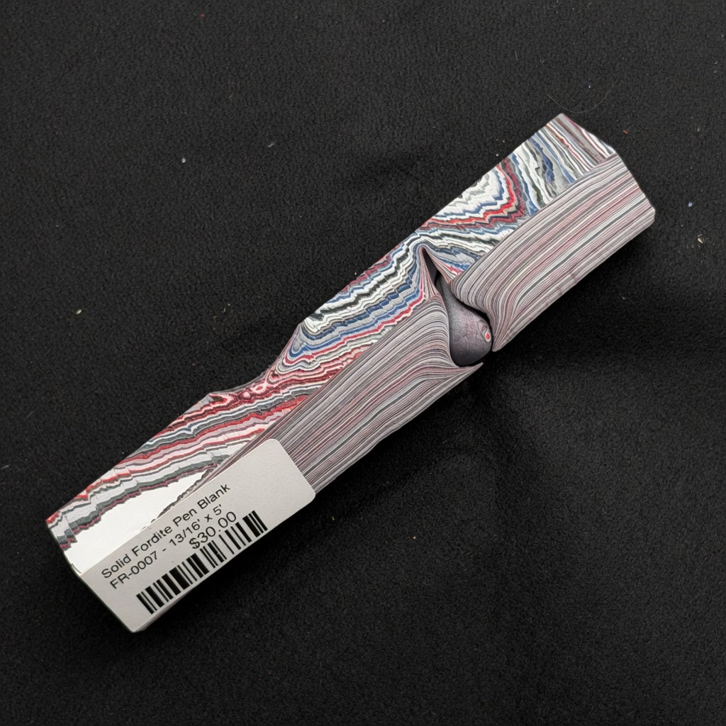 Solid Fordite pen blank FR-0007 with vibrant red, blue, white and gray layered paint stripes