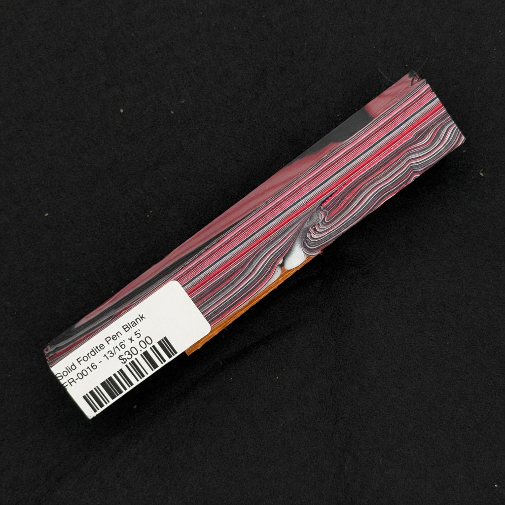 Solid Fordite pen blank FR-0016 displaying rich layers of red, pink, black and gray industrial paint