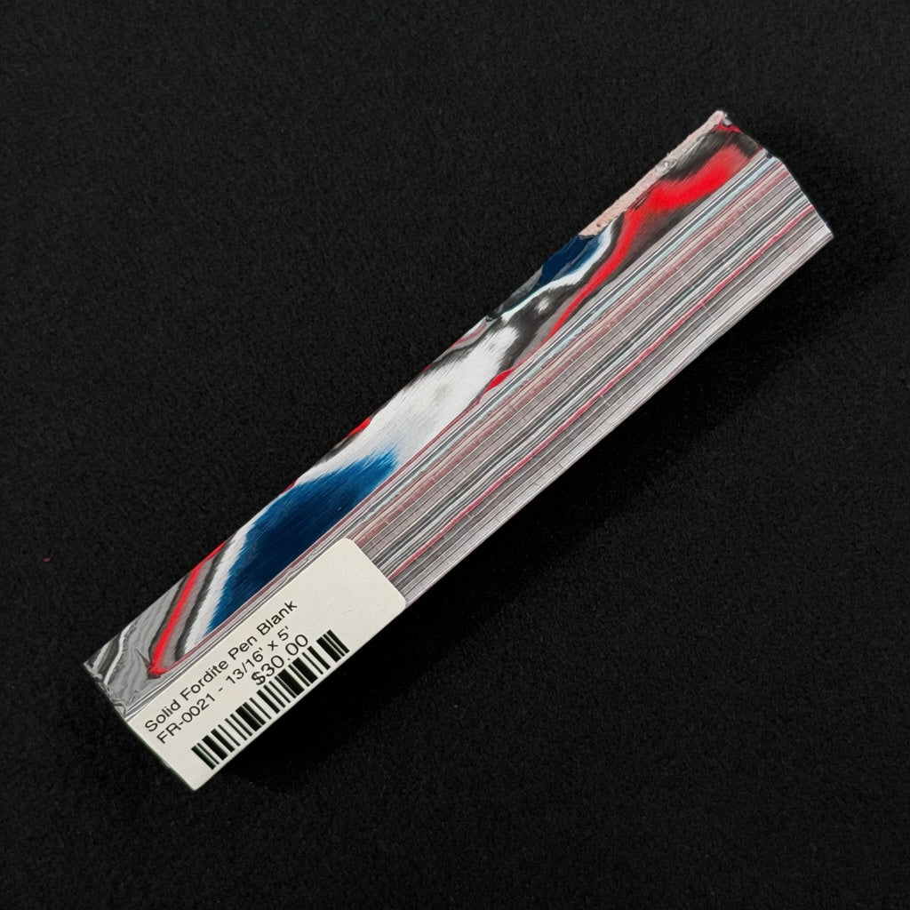 Solid Fordite pen blank FR-0021 with vibrant red, blue, and white layered paint swirls