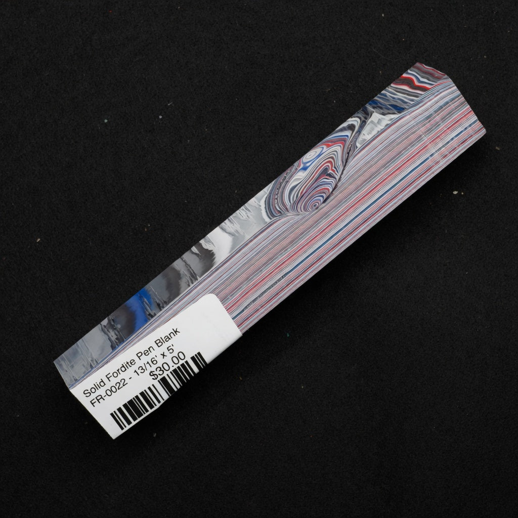Solid Fordite pen blank FR-0022 showing vibrant red, blue, white and gray layered paint stripes with swirling patterns
