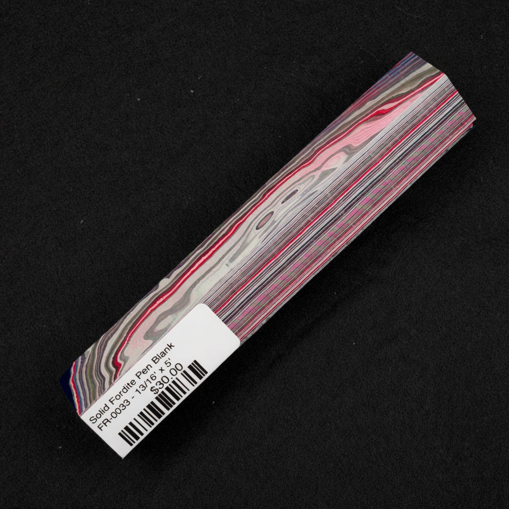 Solid Fordite pen blank FR-0033 reveals vibrant red pink and blue layers from decades of baked automotive overspray
