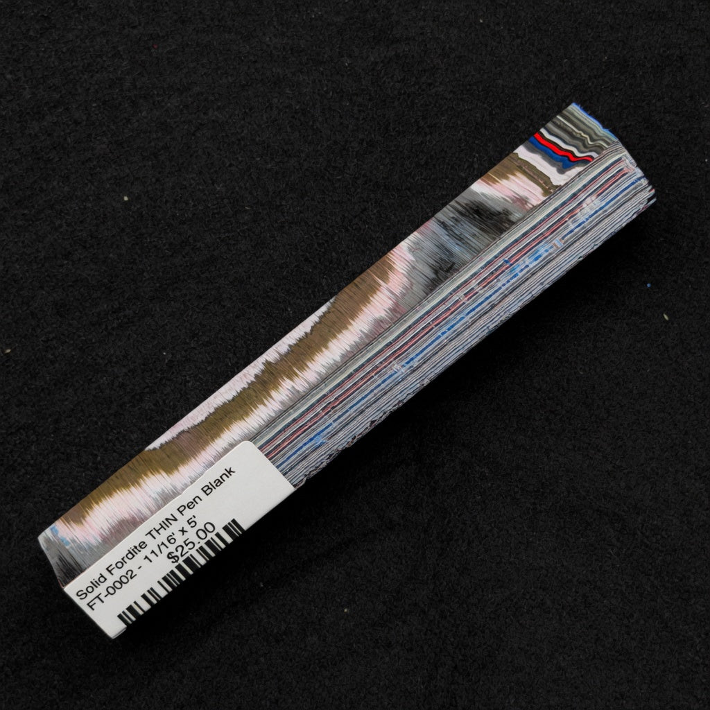 Solid Fordite pen blank FT-0002 displaying layered bands of brown, pink, blue, red and gray automotive paint