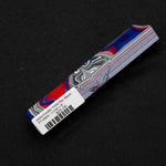 Solid Fordite pen blank FT-0004 with vibrant red and blue layers alongside gray and white automotive paint stripes