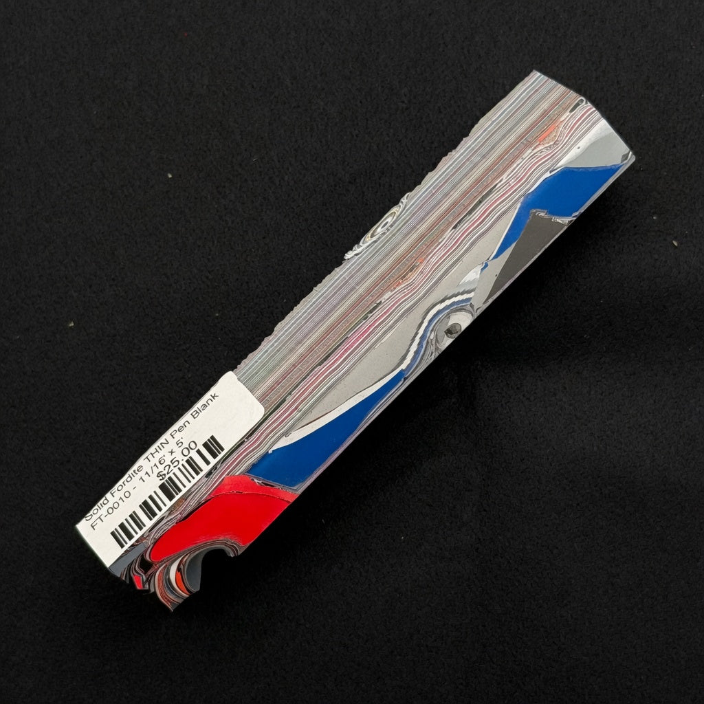 Solid Fordite pen blank FT-0010 with vibrant red, blue and silver layered automotive paint patterns