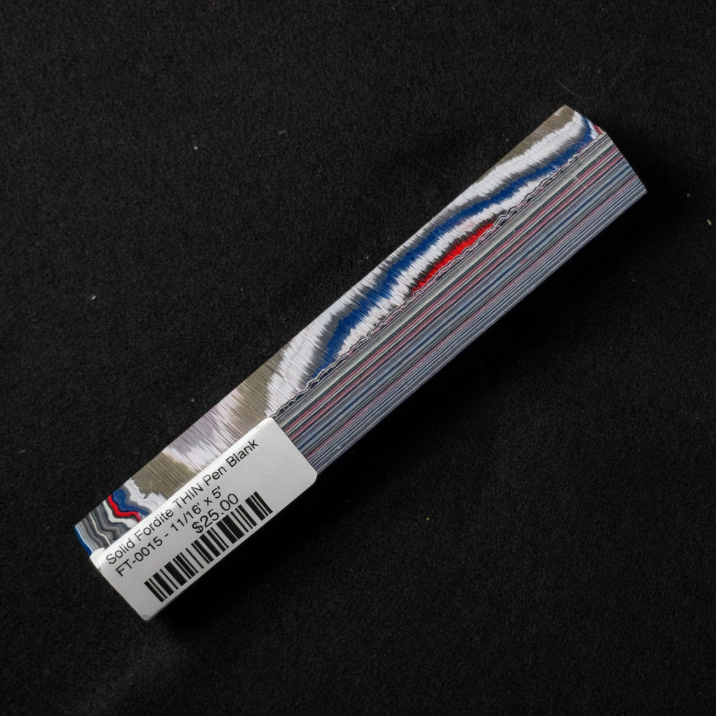 Solid Fordite THIN pen blank FT-0015 displaying bold blue, red, and white layered paint bands
