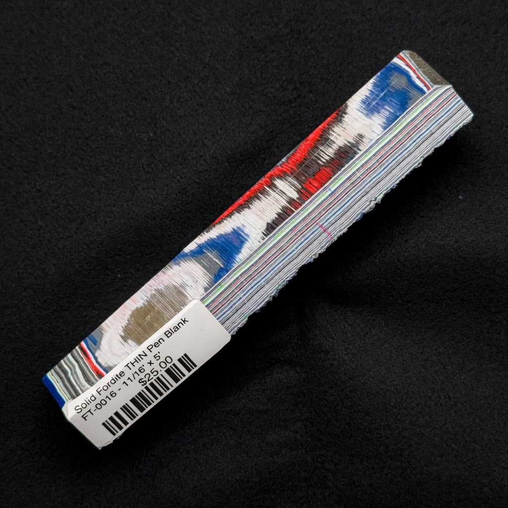 Solid Fordite pen blank FT-0016 with bold red, blue and white layers accented by gray and black paint strata