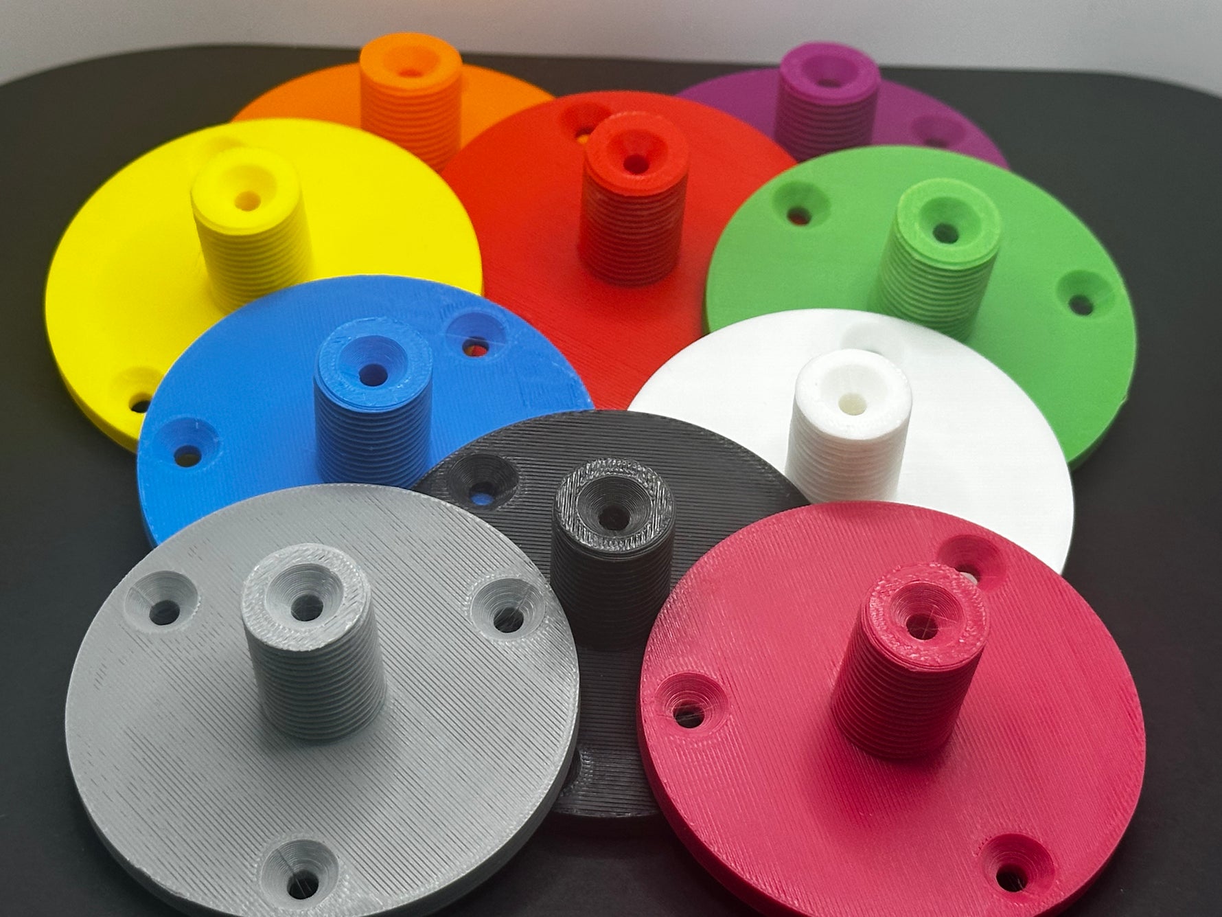 3D printed lathe chuck holder mounted on workshop wall