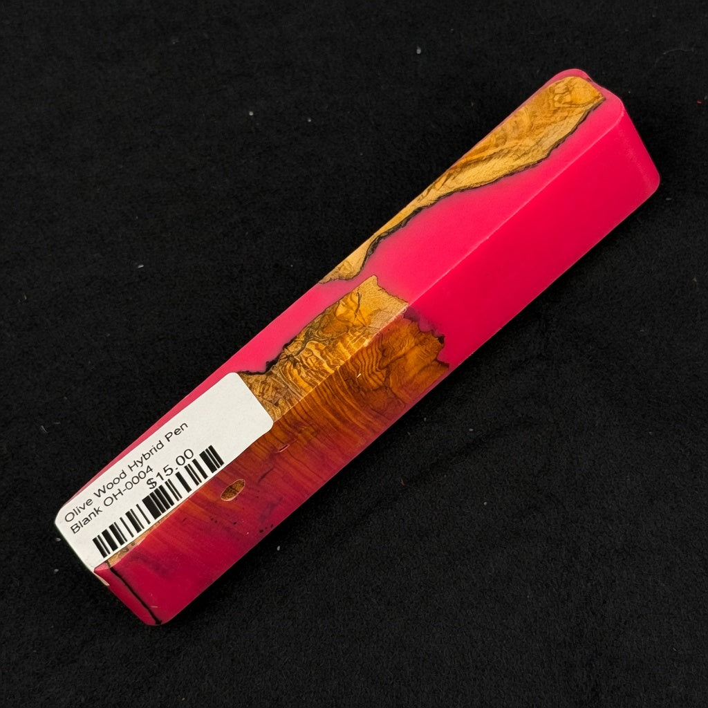 Vibrant pink resin surrounds rich olive wood burl with warm orange, brown and yellow tones on pen blank OH-0004
