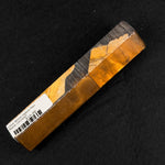 Olive wood hybrid pen blank OH-0007 displaying rich golden brown and dark brown wood grain next to warm amber and orange resin